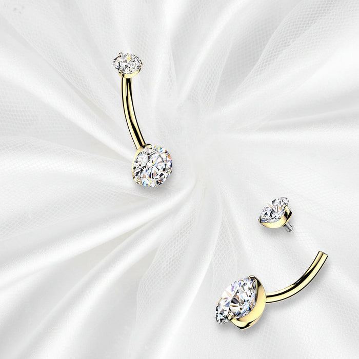Gold belly button rings with colorful gemstones on a white background