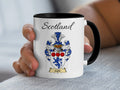 Caird Scottish family crest accent mug with Scotland above the coat of arms design