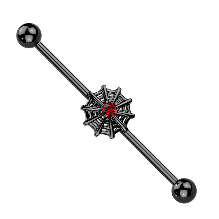 Black spider web earring with red gem on a white background