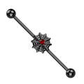 Black spider web earring with red gem on a white background