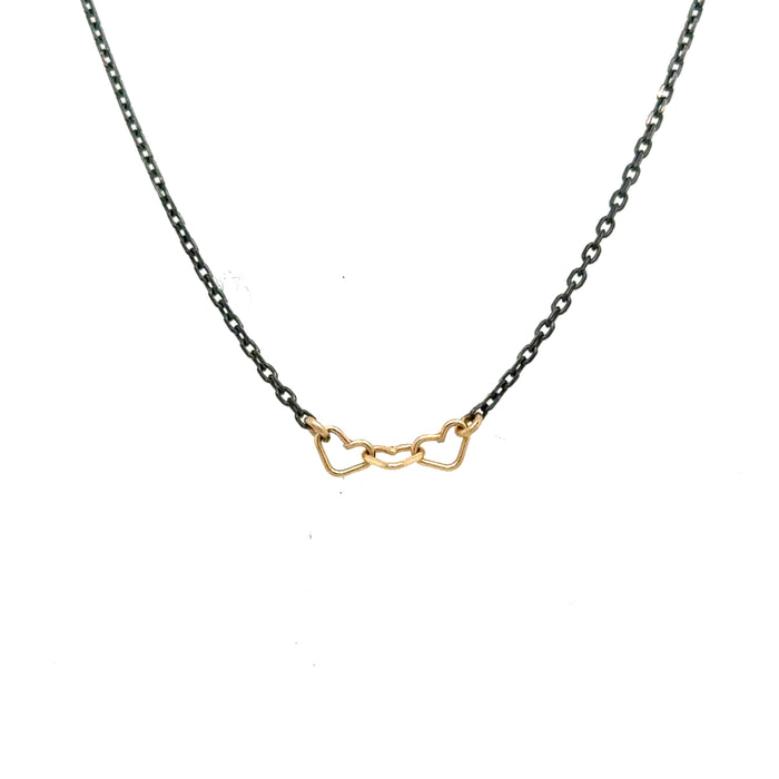 handmade necklace with 3 tiny 14K yellow gold wire hearts on oxidized sterling silver chain