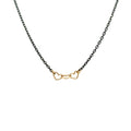 handmade necklace with 3 tiny 14K yellow gold wire hearts on oxidized sterling silver chain