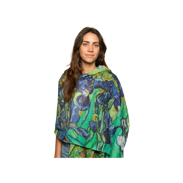 A person wearing a scarf with a detailed floral pattern, reminiscent of the 'Irises' painting by Vincent van Gogh.